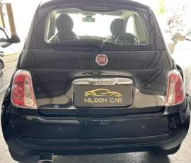 Rear view of a black Fiat hatchback with Fiat badge and a Nilson Car plate frame, showing taillights and exhaust.