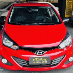 Front view of a red Hyundai car in a showroom, license plate reads NILSON CAR.